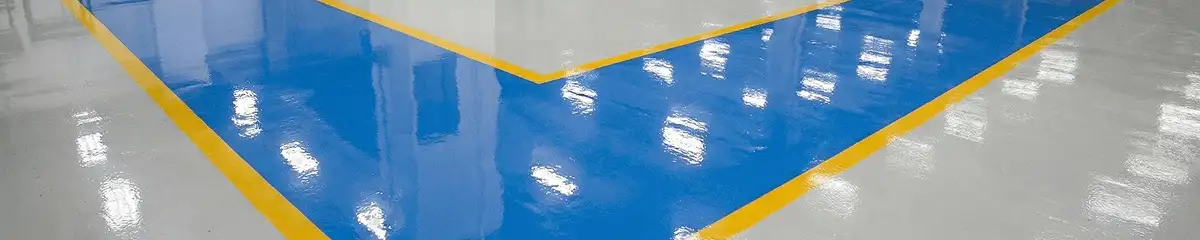A factory floor professionally covered and marked with epoxy flooring in Tuscaloosa, AL