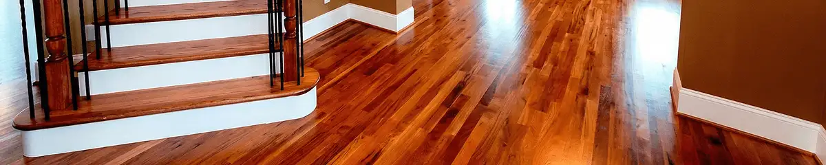 Base floor of a staircase with professionally restored wood flooring in Tuscaloosa AL