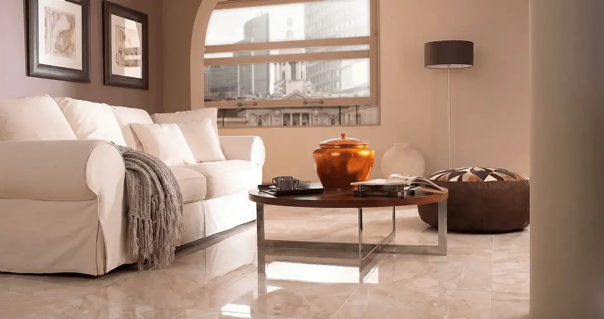 Modern living room with professionally installed marble flooring, a beige sofa, coffee table in Tuscaloosa, AL