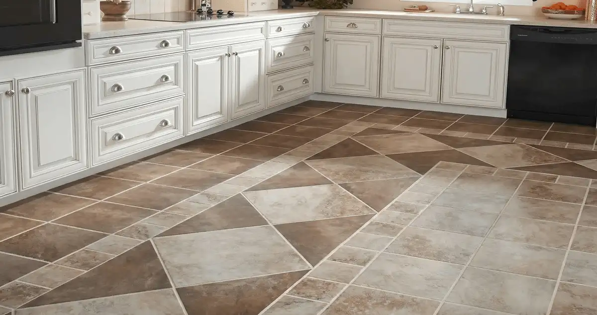 Kitchen with white cabinets and a professionally installed tile floor in Tuscaloosa, AL